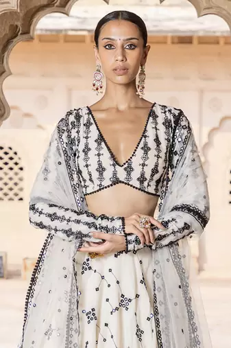 WHITE SEQUIN EMBROIDERED COTTON SILK A LINE LEHENGA CHOLI WITH DUPATTA.