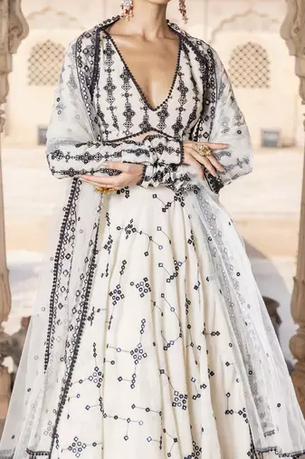 WHITE SEQUIN EMBROIDERED COTTON SILK A LINE LEHENGA CHOLI WITH DUPATTA.