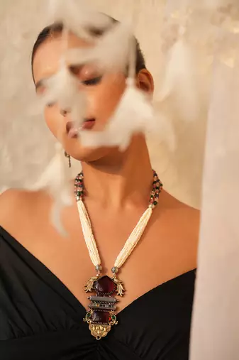 Avira long necklace set with maroon gemstone and peacock pendant