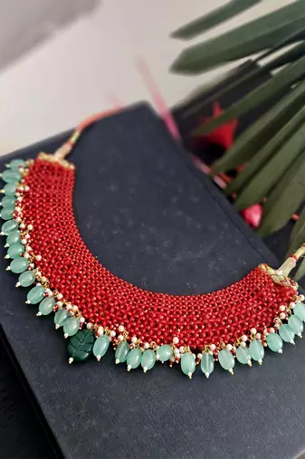 Manika red beaded necklace with semi-precious green stones