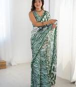 Lovely green printed designer saree with blouse