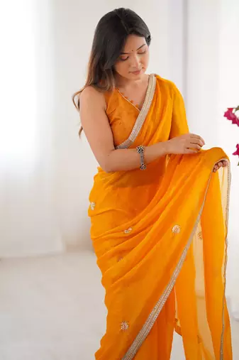 Majestic orange silk sequins haldi wear saree with blouse