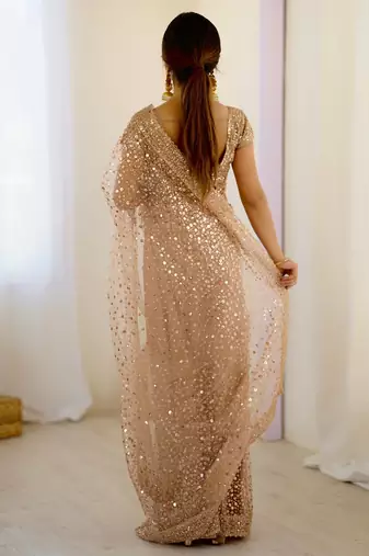Gorgeous gold net sequins party wear saree with blouse