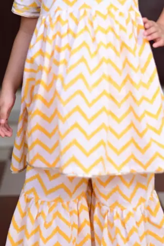 Yellow chevron block printed cotton sharara kurta set with gota embroidery for girl