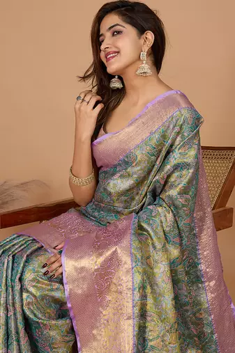 Green woven banarasi design saree with blouse piece