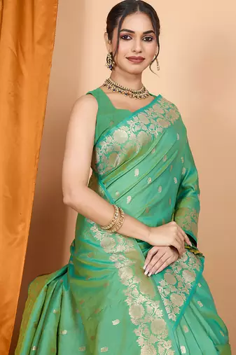 Green woven banarasi design saree with blouse piece