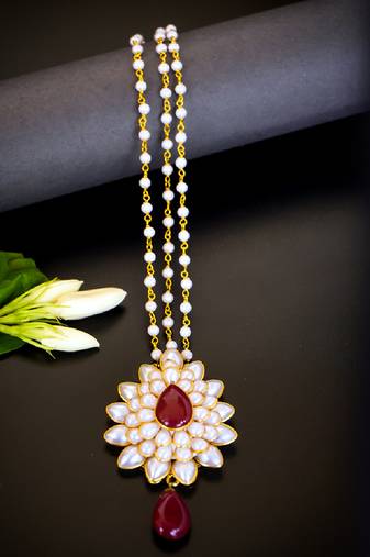   radiant pearl cluster maang tikka with maroon teardrop stone