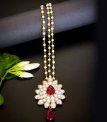   radiant pearl cluster maang tikka with maroon teardrop stone