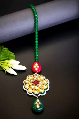 Traditional kundan floral maang tikka with red & green