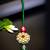 Traditional kundan floral maang tikka with red & green