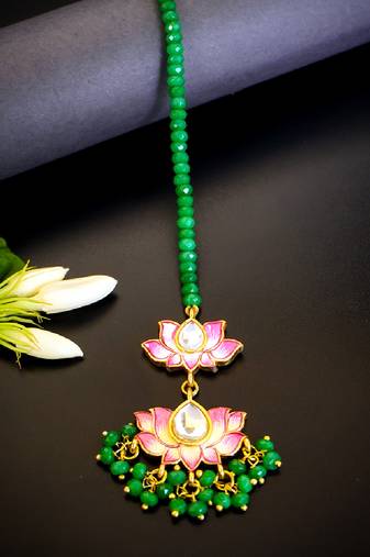 Pink lotus kundan maang tikka with green bead detailing