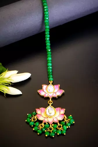 Pink lotus kundan maang tikka with green bead detailing