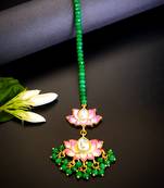 Pink lotus kundan maang tikka with green bead detailing