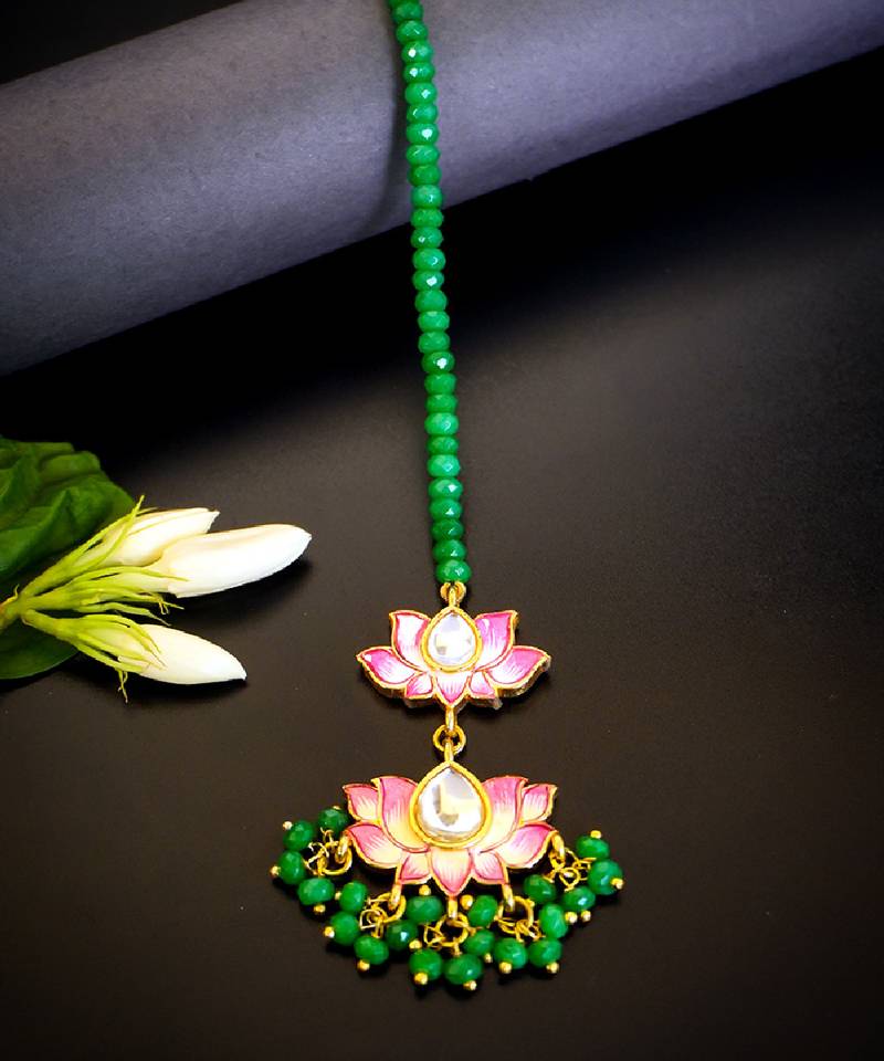 Pink lotus kundan maang tikka with green bead detailing