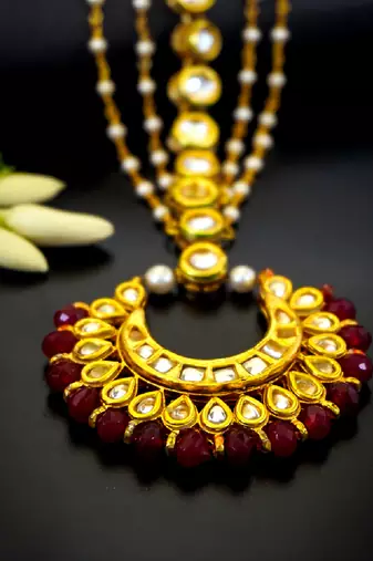 Royal crescent kundan maang tikka with ruby bead detailing