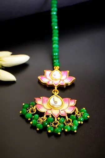 Pink lotus kundan maang tikka with green bead detailing