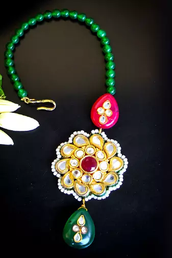Traditional kundan floral maang tikka with red & green