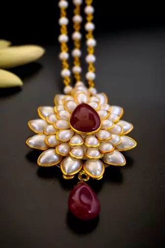   radiant pearl cluster maang tikka with maroon teardrop stone