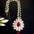   radiant pearl cluster maang tikka with maroon teardrop stone