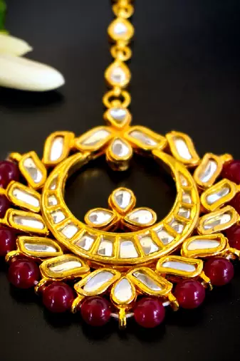   regal kundan chandbali maang tikka with ruby beads