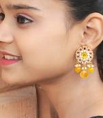 Elegant drop earrings with intricate stone and pearl detailing