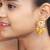 Elegant drop earrings with intricate stone and pearl detailing