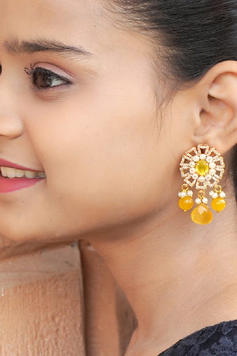 Elegant drop earrings with intricate stone and pearl detailing