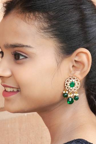 Elegant drop earrings with intricate stone and pearl detailing