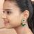 Elegant drop earrings with intricate stone and pearl detailing