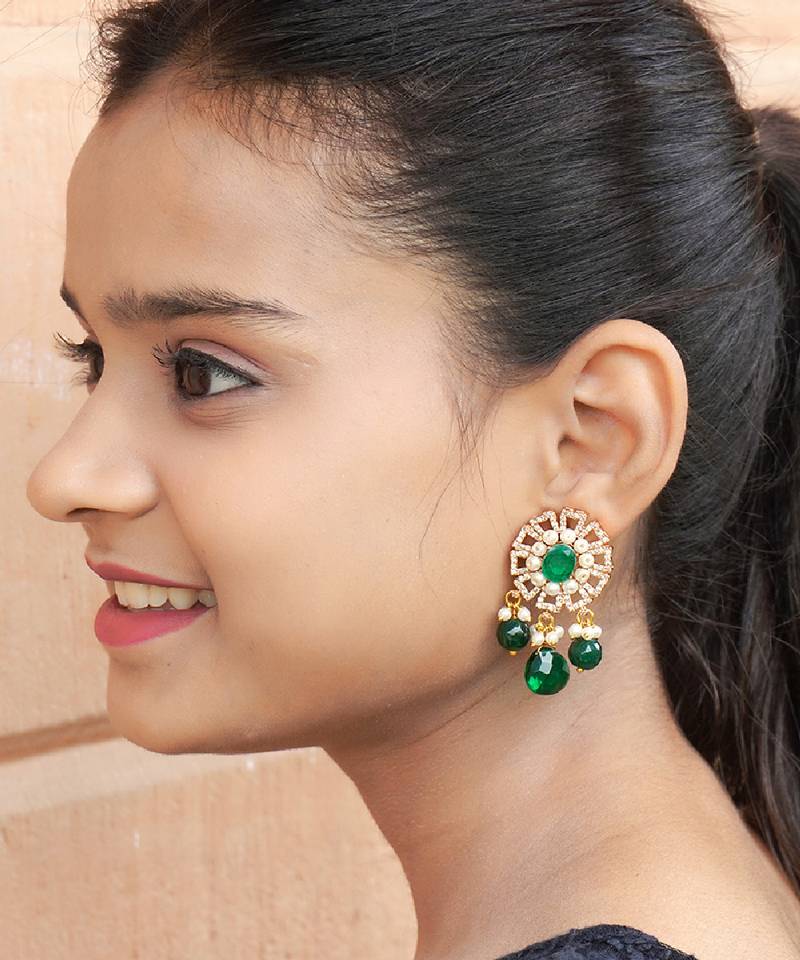 Elegant drop earrings with intricate stone and pearl detailing