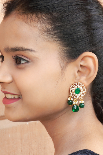 Elegant drop earrings with intricate stone and pearl detailing