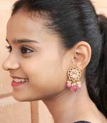 Elegant drop earrings with intricate stone and pearl detailing