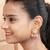 Elegant drop earrings with intricate stone and pearl detailing