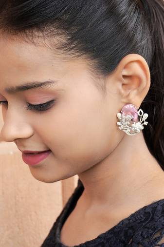 Floral-inspired stud earrings with teardrop centerpiece and pearl accents