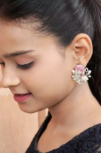 Floral-inspired stud earrings with teardrop centerpiece and pearl accents