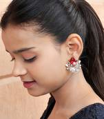 Floral-inspired stud earrings with teardrop centerpiece and pearl accents