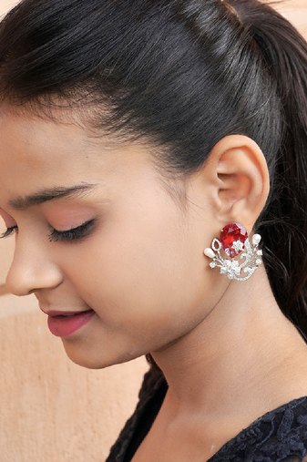 Floral-inspired stud earrings with teardrop centerpiece and pearl accents