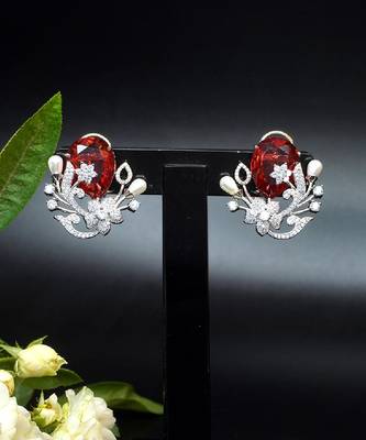 Floral-inspired stud earrings with teardrop centerpiece and pearl accents 3