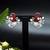 Floral-inspired stud earrings with teardrop centerpiece and pearl accents