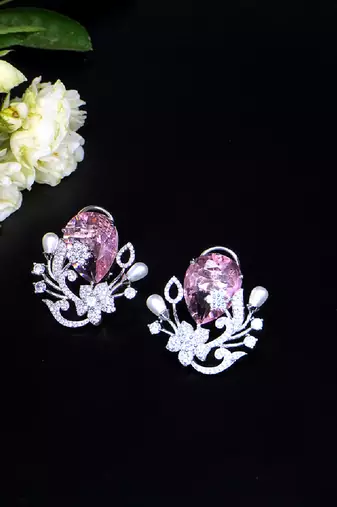 Floral-inspired stud earrings with teardrop centerpiece and pearl accents