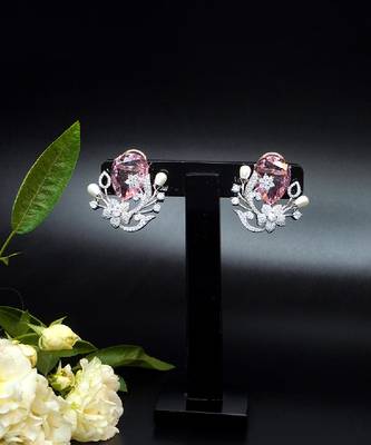 Floral-inspired stud earrings with teardrop centerpiece and pearl accents 3