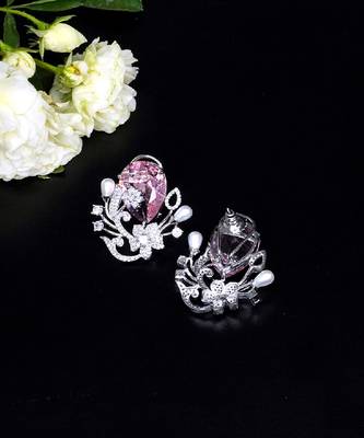 Floral-inspired stud earrings with teardrop centerpiece and pearl accents 4
