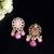 Elegant drop earrings with intricate stone and pearl detailing