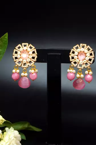 Elegant drop earrings with intricate stone and pearl detailing