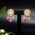 Elegant drop earrings with intricate stone and pearl detailing