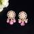 Elegant drop earrings with intricate stone and pearl detailing