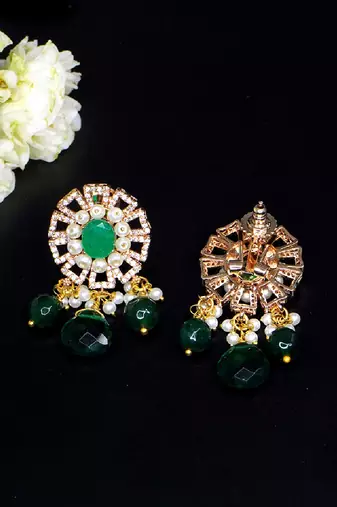 Elegant drop earrings with intricate stone and pearl detailing