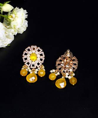 Elegant drop earrings with intricate stone and pearl detailing 2