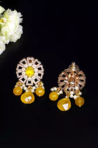 Elegant drop earrings with intricate stone and pearl detailing