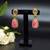 Elegant oval drop earrings with triple gemstone design